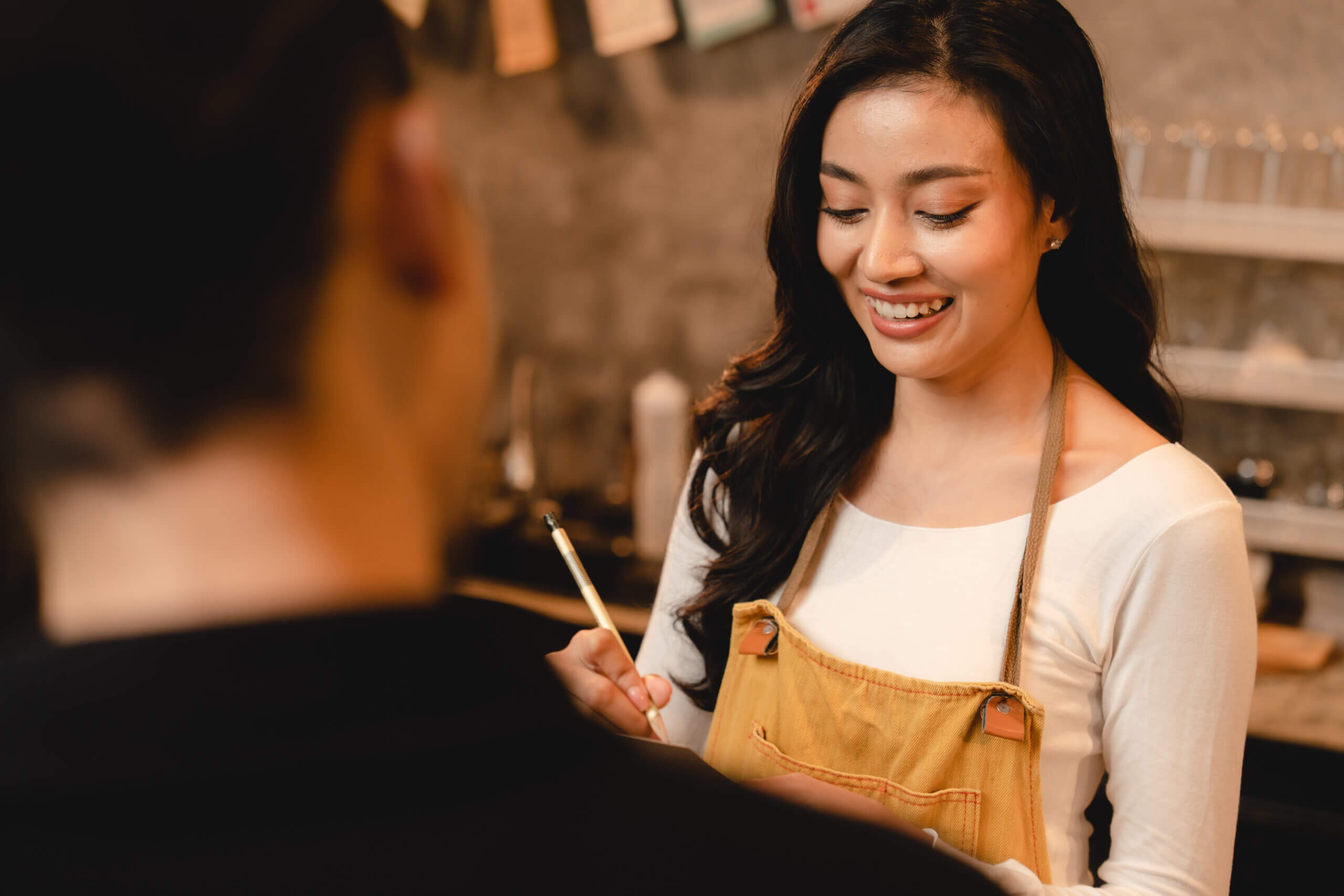 Happy barista and a happy customer