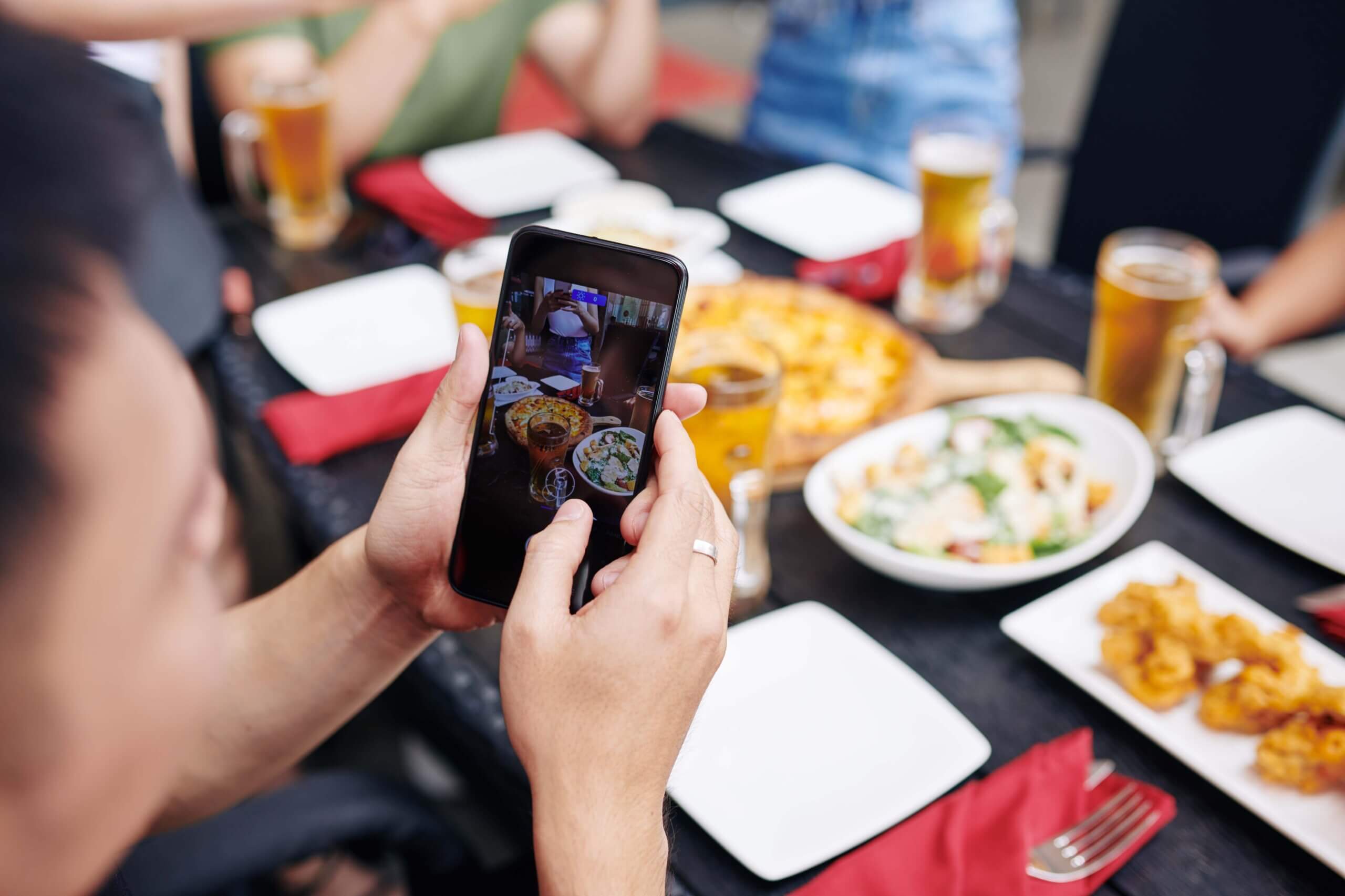 Customer taking photos of the dishes served at the restaurant