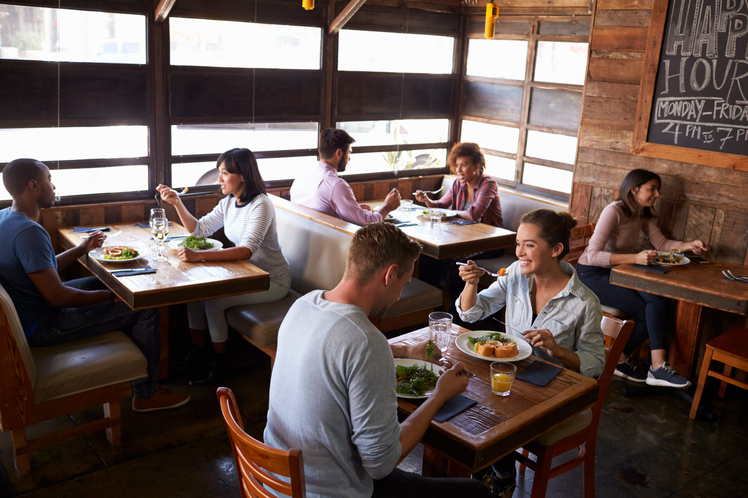 People relaxing over lunch in a restaurant