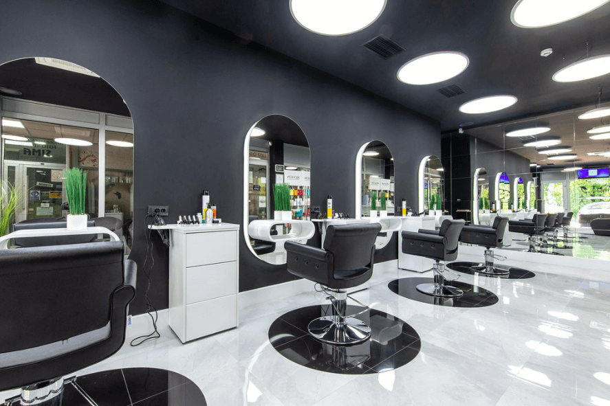 A luxurious black and white themed salon with elegant furnishings and modern decor