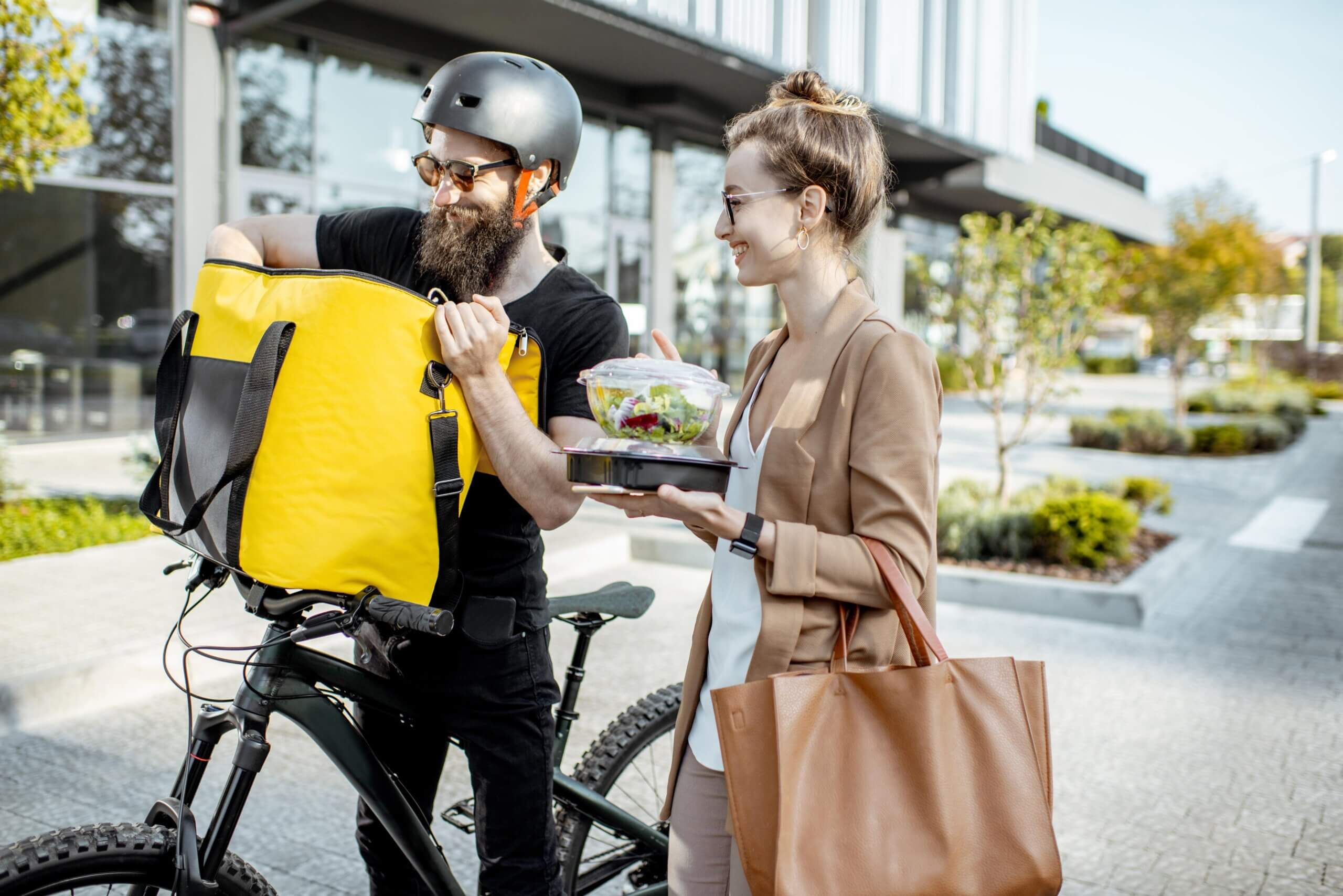 courier-delivering-food-to-a-business-woman
