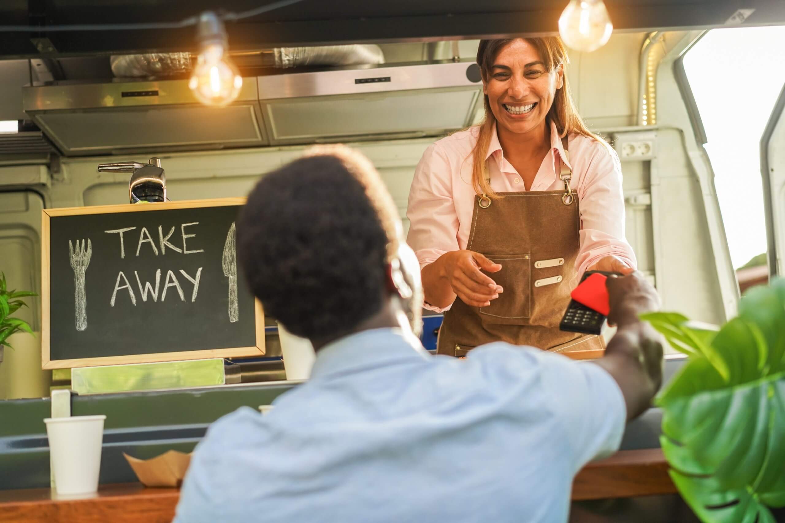 happy-customer-and-food-truck-owner-at-the-point-of-sale