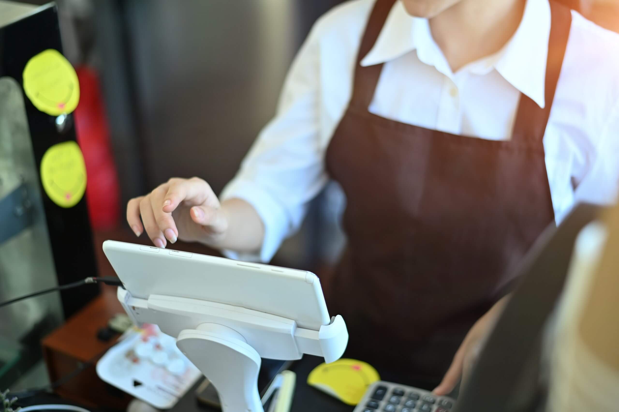 a cashier using pos system in a salon