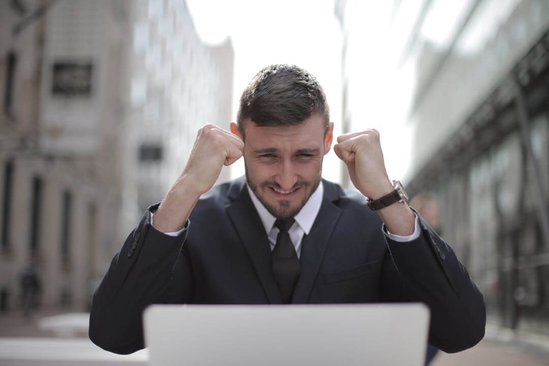 man celebrating small business success through csr projects