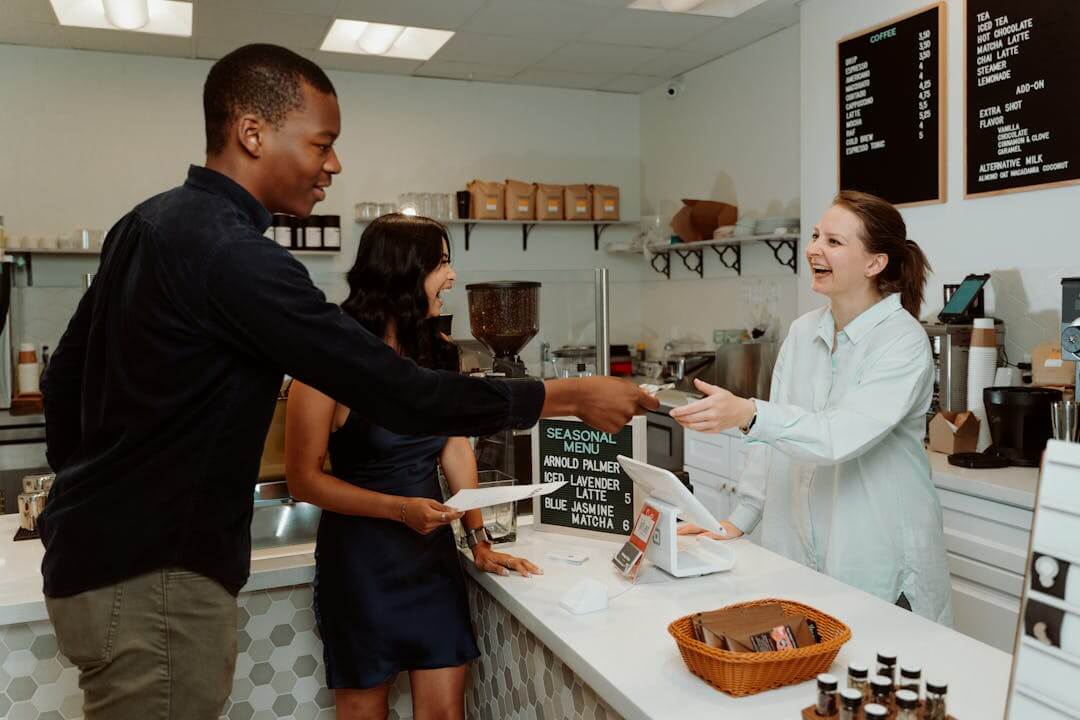 picture shows two people are dealing with the cashier through a windows compatible POS software
